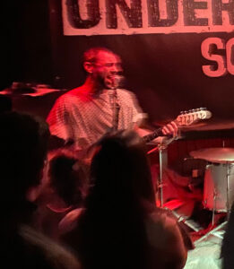Guitar teacher performing live